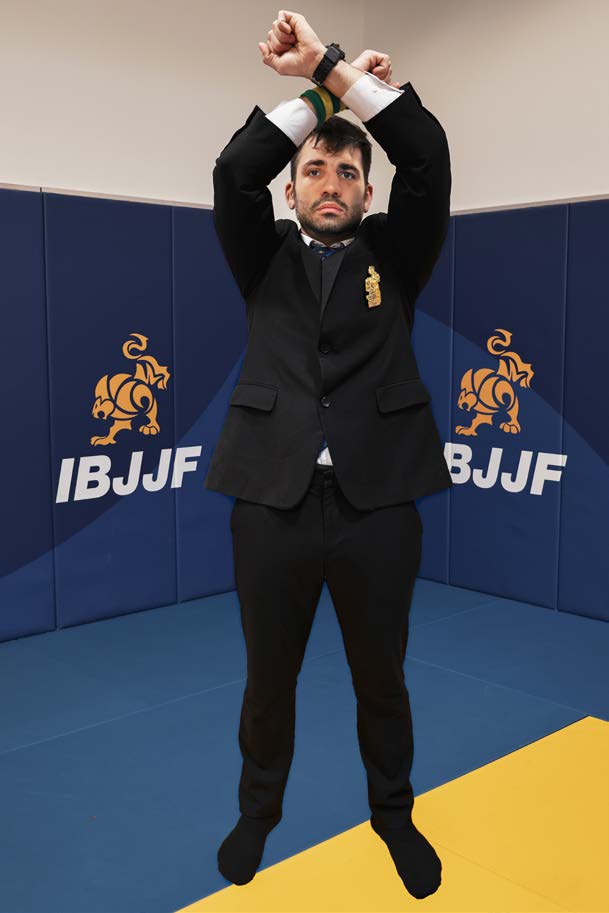 Referee signal for disqualification - forearms crossed over head with fists clenched