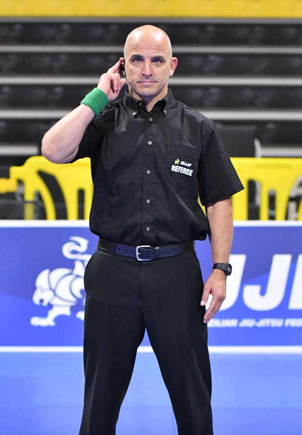 Referee signal for fingers inside garment - hand placed on opposite arm