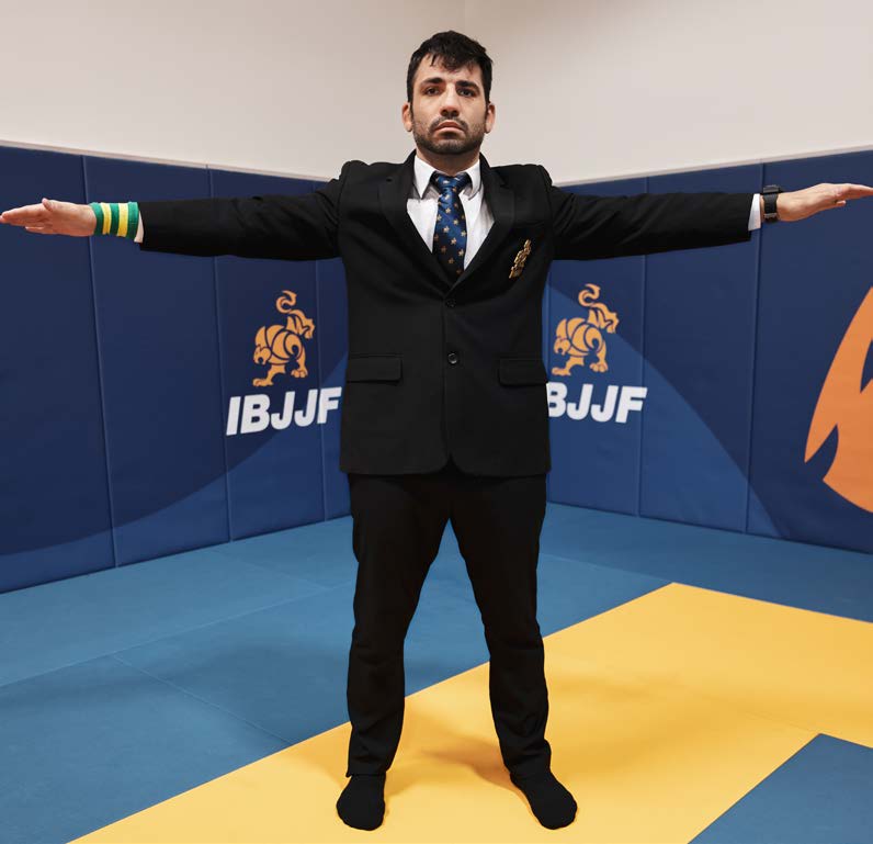 Referee signal for interruption - arms open and raised at shoulder height