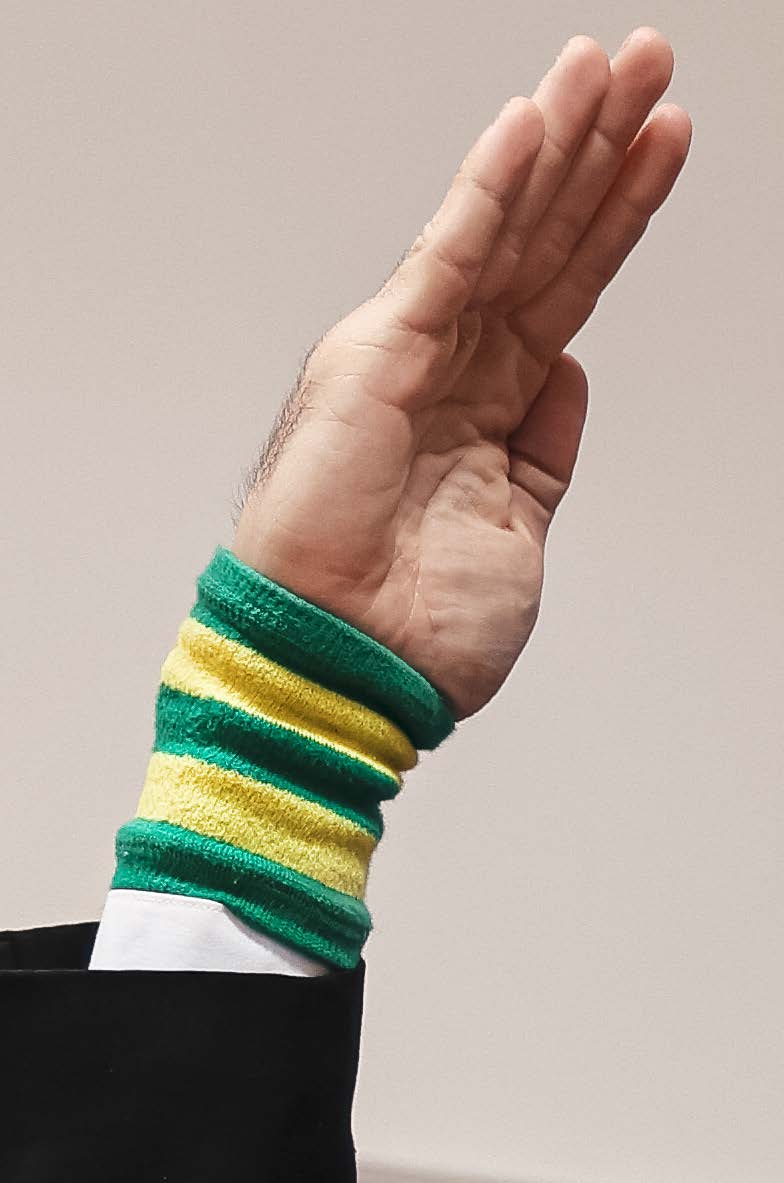 Referee signal for point deduction close-up - open palm at shoulder height