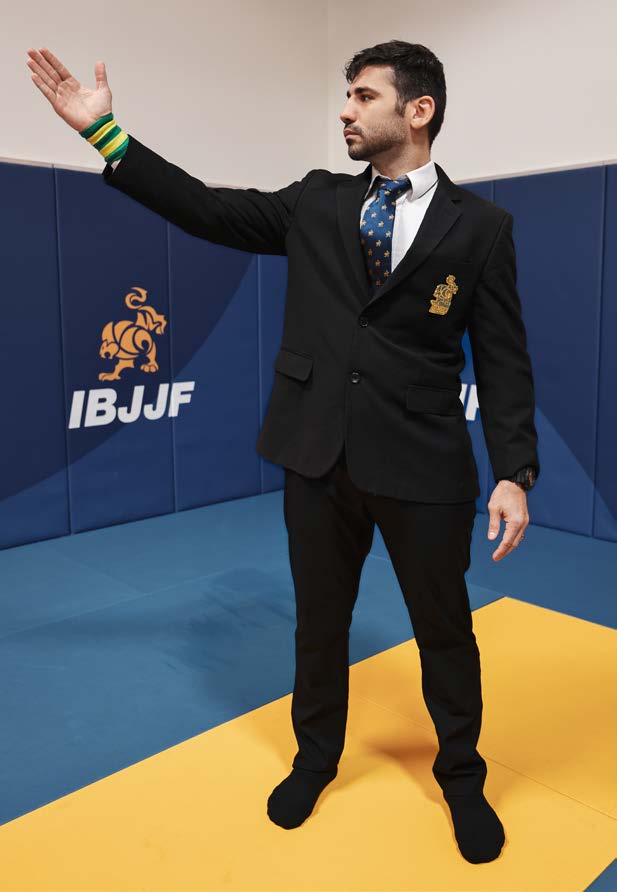 Referee signal to remain in area - open palms making circular motion