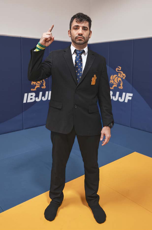 Referee signal to stand up - extended arm indicating athlete