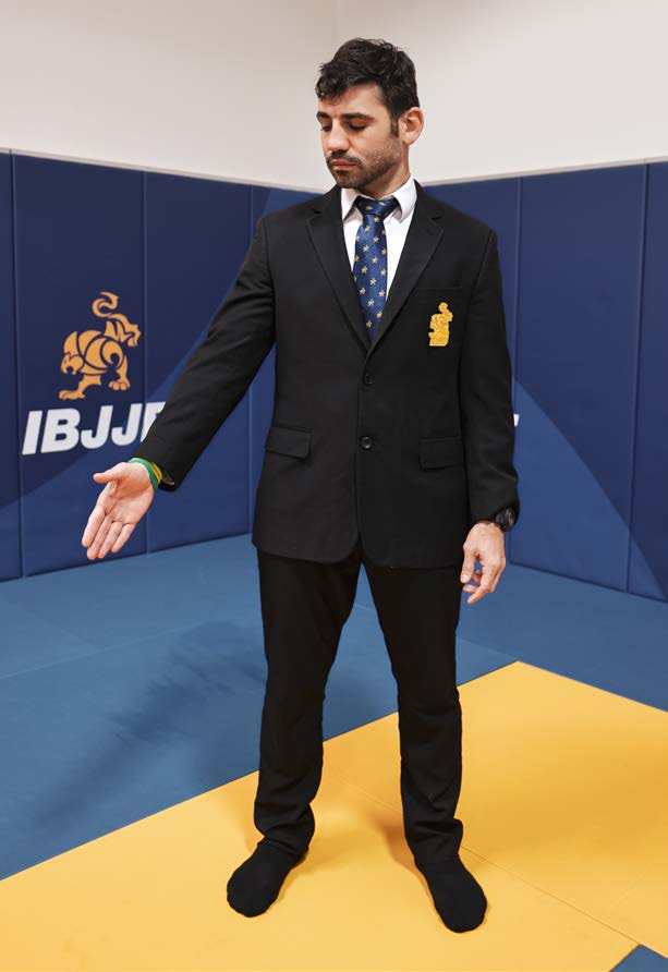 Referee signal to stand up - arm raised to shoulder height