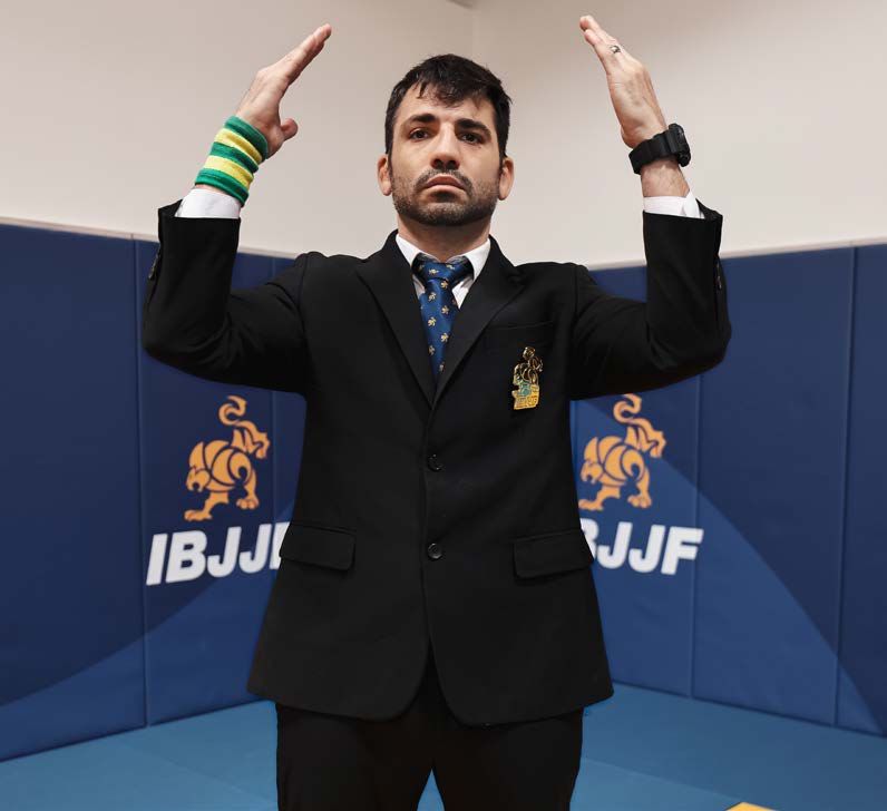 Referee signal to summon athletes - arms raised to shoulder height, bent at 90 degrees