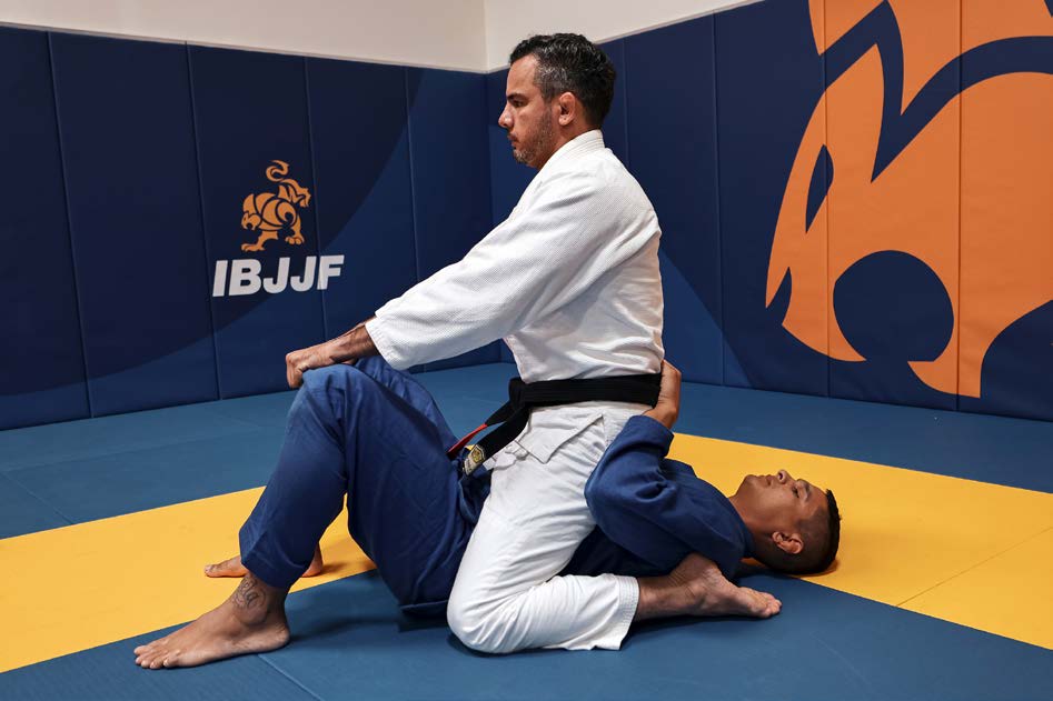 Back control - one arm trapped, hooks in