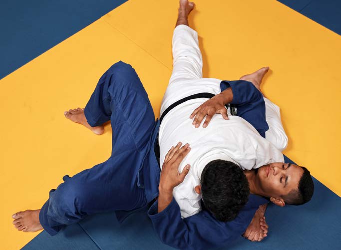 Half-guard example - bottom athlete traps one leg