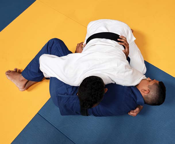 Half-guard example - top athlete's leg trapped