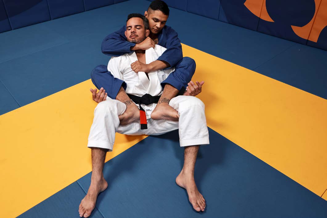 Sweep sequence - bottom athlete begins sweep from guard